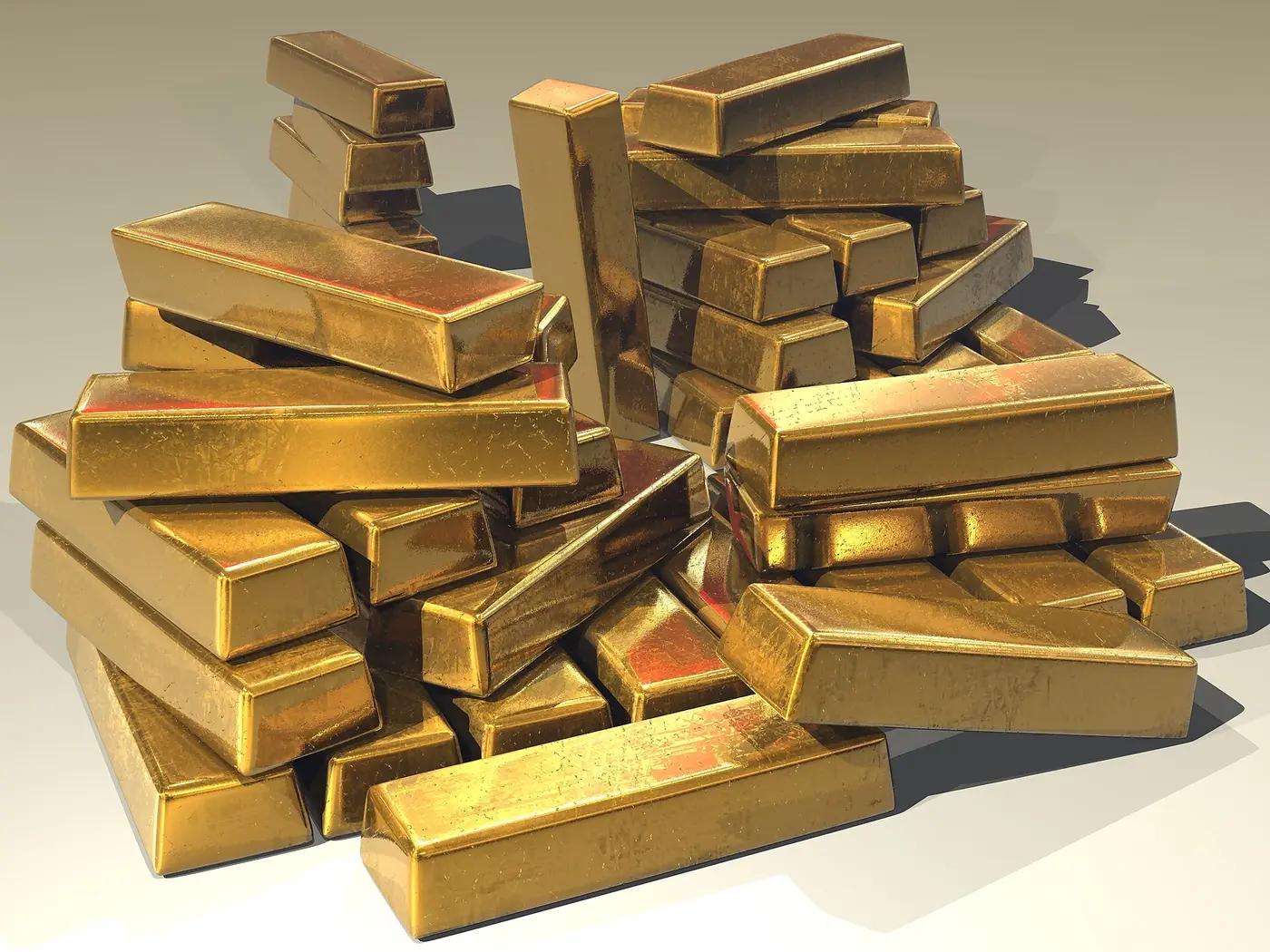 Stacked unbranded gold bullion bars