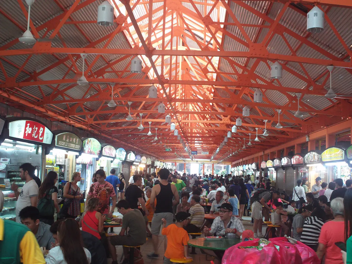 Lunch crowd and food stalls inside Maxwell Food Centre in Singapore